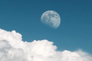 Full moon appears during daytime in late afternoon